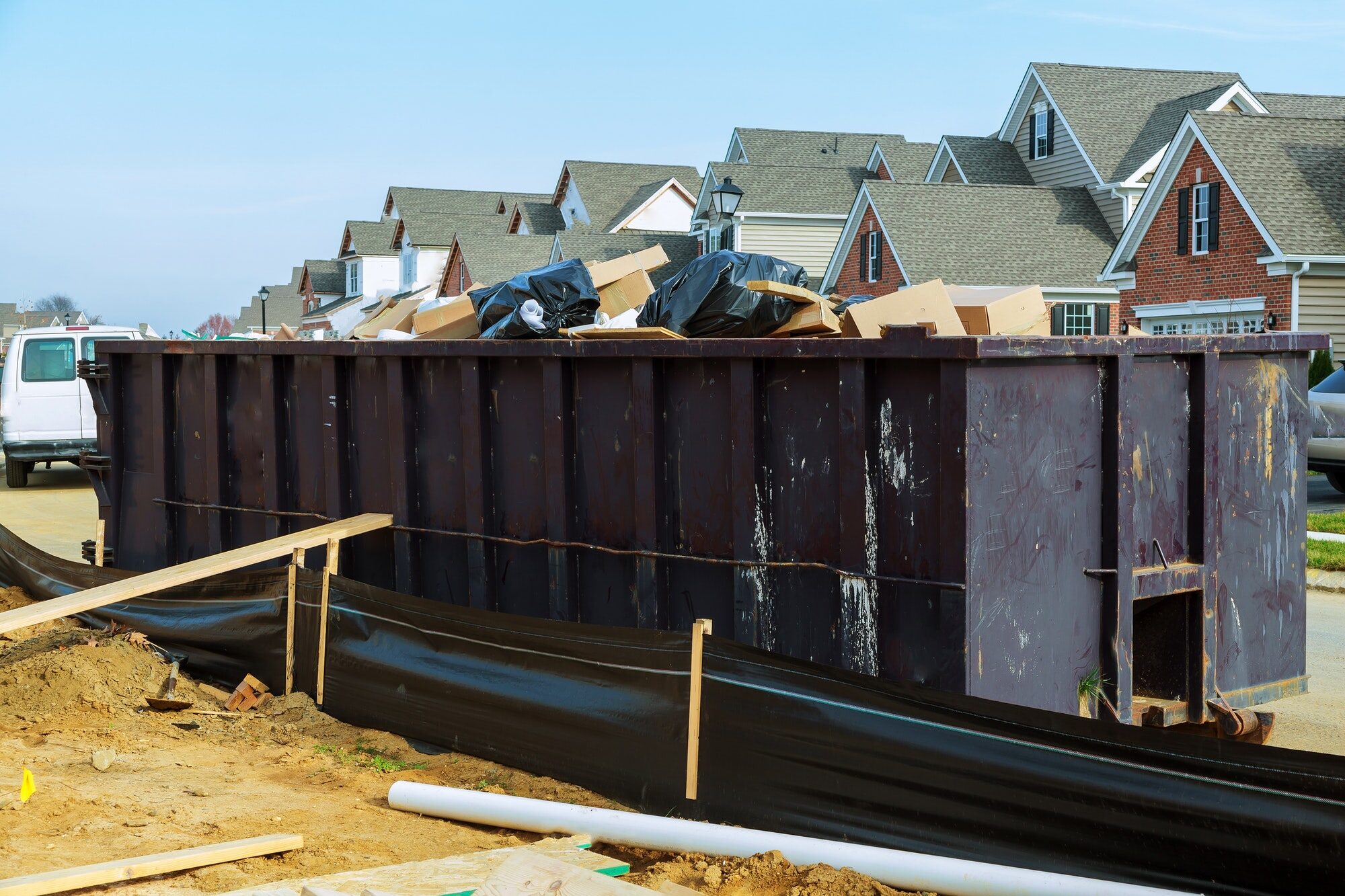 A roll off container loaded with construction and demolition debris