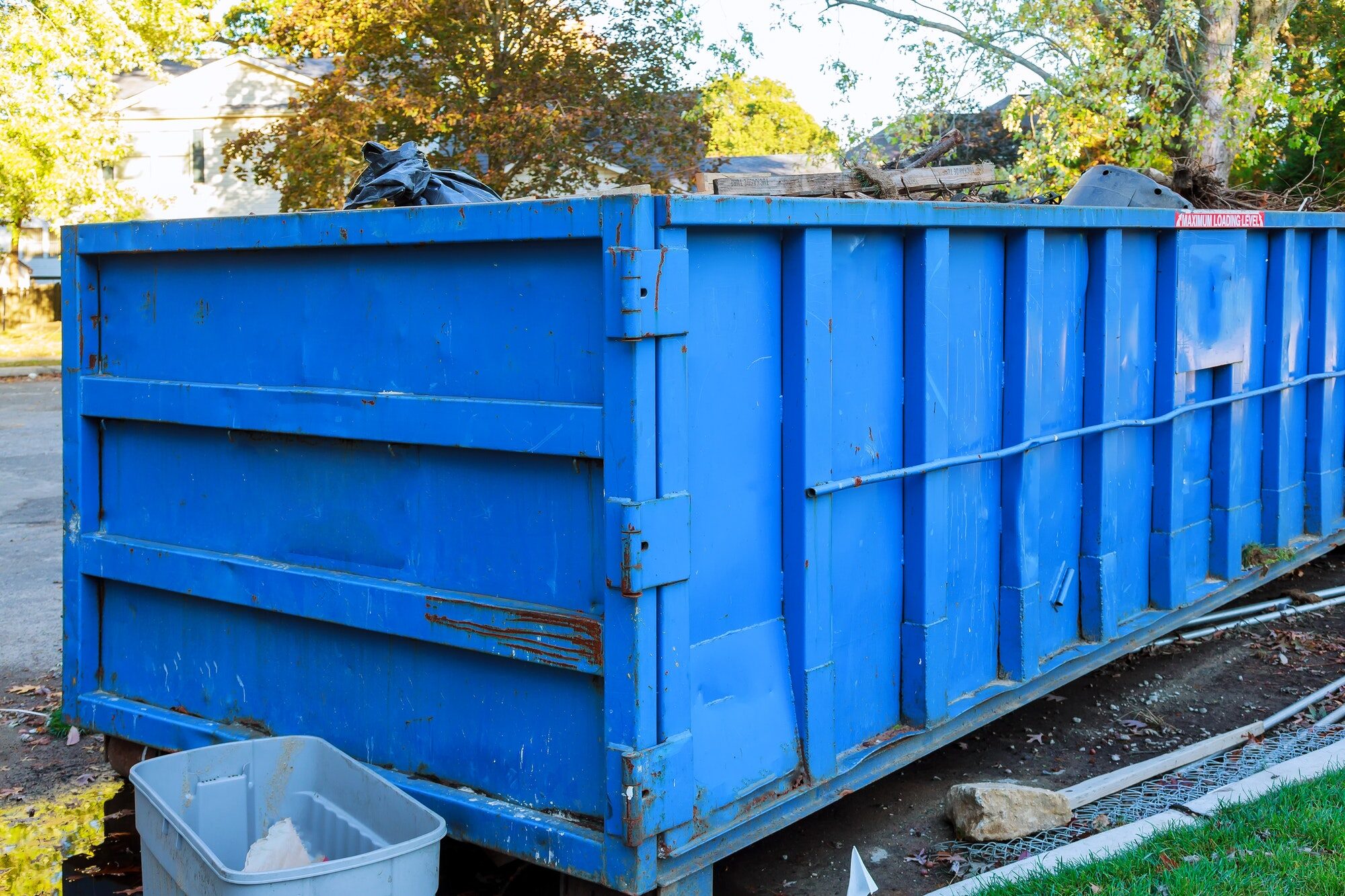 A container filled with unsorted mixed waste