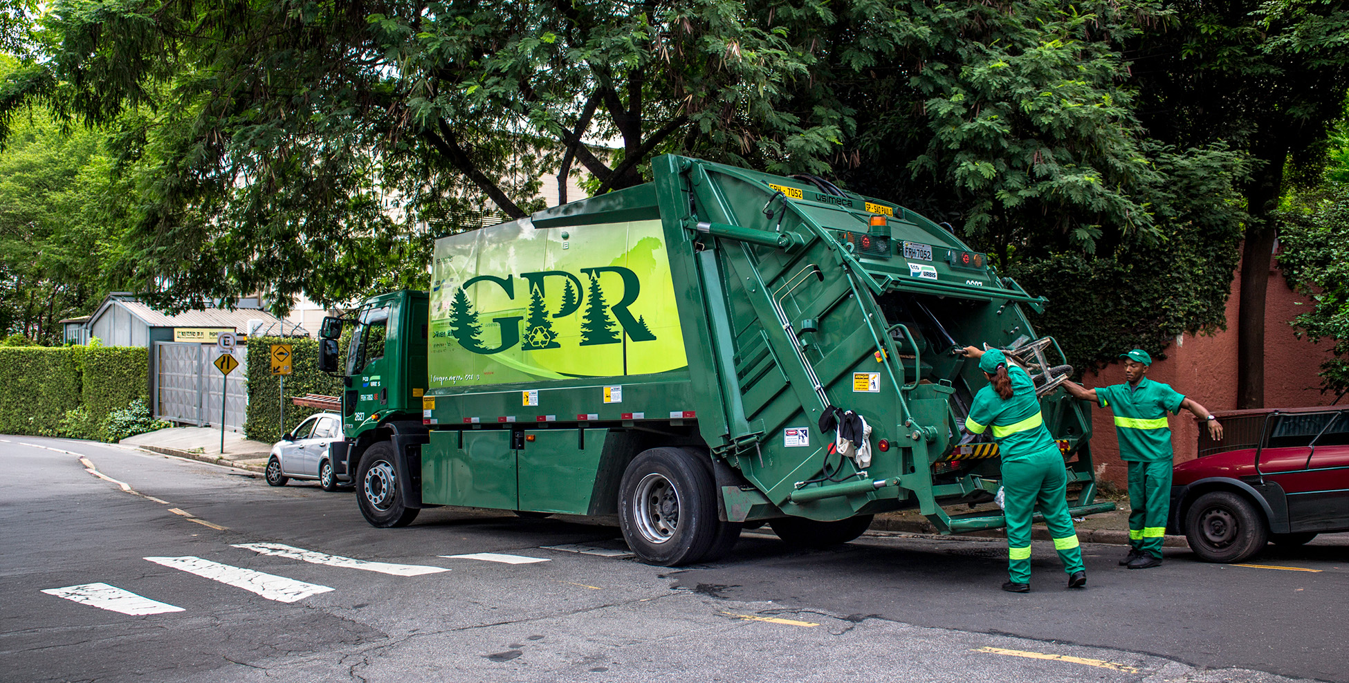A Green Pine Recycling collection truck working a kerbside route